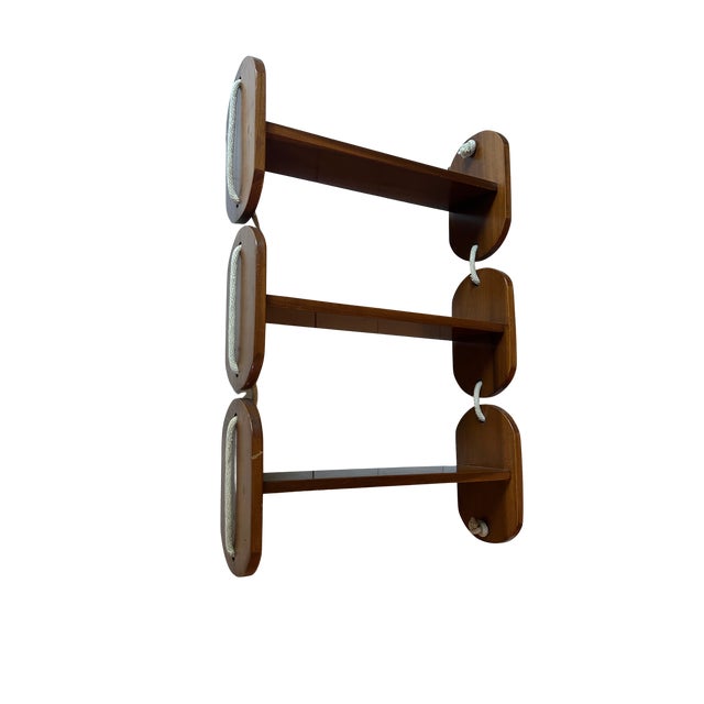 MCM hanging three-shelf wall unit with nautical rope.