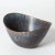 Beautiful stoneware bowl by Gunnar Nylund, in an oval boat shape with an undulating edge. Purple and blue glaze with...