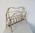 A midcentury magazine rack in brass produced in Italy during the 1950s. The magazine rack has a high quality and the...