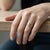 A sophisticated and iconic creation from the legendary House of Cartier. This three-tone 18k gold ring features three...