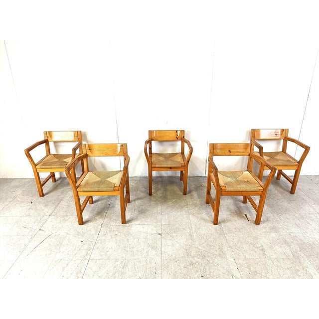 Elegant pine wood dining chairs with armrests and papercord seats by GM mobler. These sturdy chairs have an simple yet...