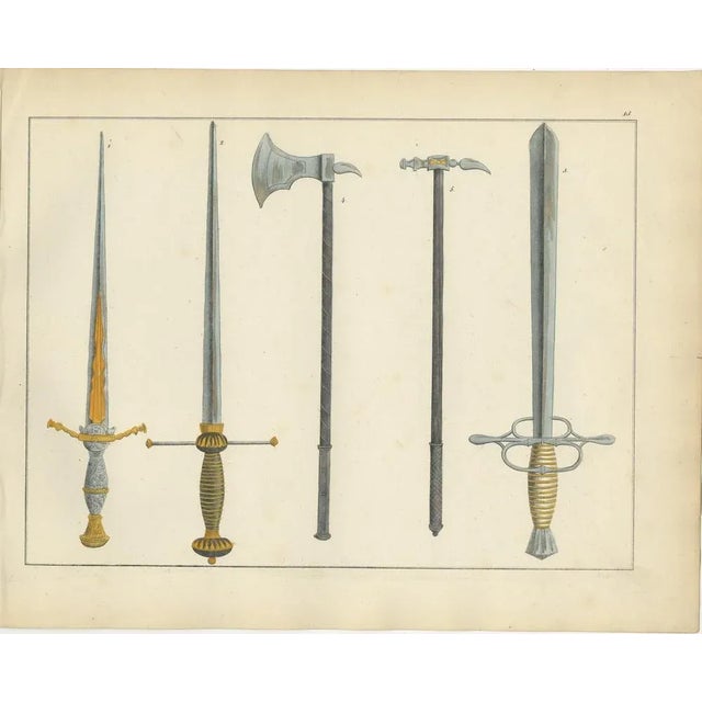 19th-century hand-coloured lithograph of swords, axes, and war hammers : this finely executed hand-coloured lithograph...