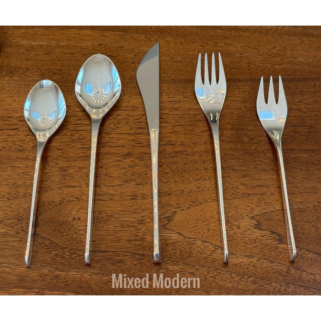 A service for twelve, of sculptural, Vision mid century modern flatware in sterling silver created by the artist and...