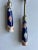 Vintage blue, white and orange Chinoiserie salad utensils. Marked S N and What looks like a Bee. Measures 10.5 l x 1.85w x...