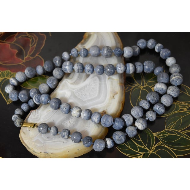 Vintage Natural Denim Blue Sponge Coral Hand Knotted Bead Necklace 32" Long. Made up of several sizes of blue hand-carved...