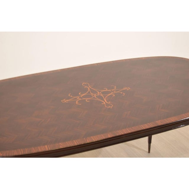 An elegant table attributed to Paolo Buffa, made in Italy in the 1950s, this refined expression of postwar Italian design...