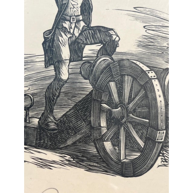 TAn original vintage mid-century wood engraving depicting a Continental Army artillery soldier resting his foot on a...