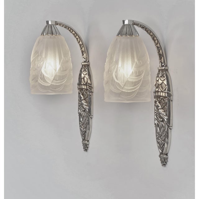 Pierre Maynadier & Charles Schneider A beautiful pair of 1925-1930 French art deco wall sconces in nickel on cast bronze...