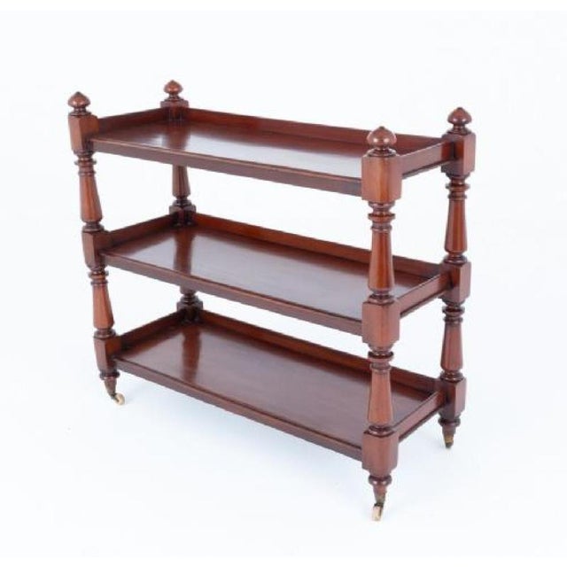 Victorian mahogany dumb waiter. Circa 1860. This dumb waiter features 3 working shelves. The shelves are supported on...