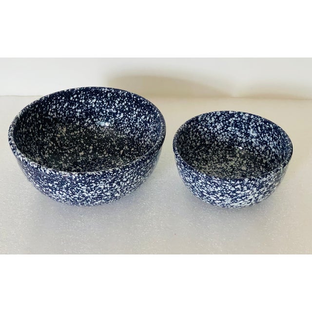 Two spattered ceramic blue white mixing bowls.
