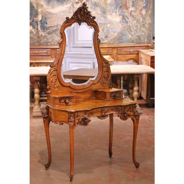 Elegant late 19th-century French Louis XV style coiffeuse (dressing table) crafted in richly figured walnut, circa 1880....