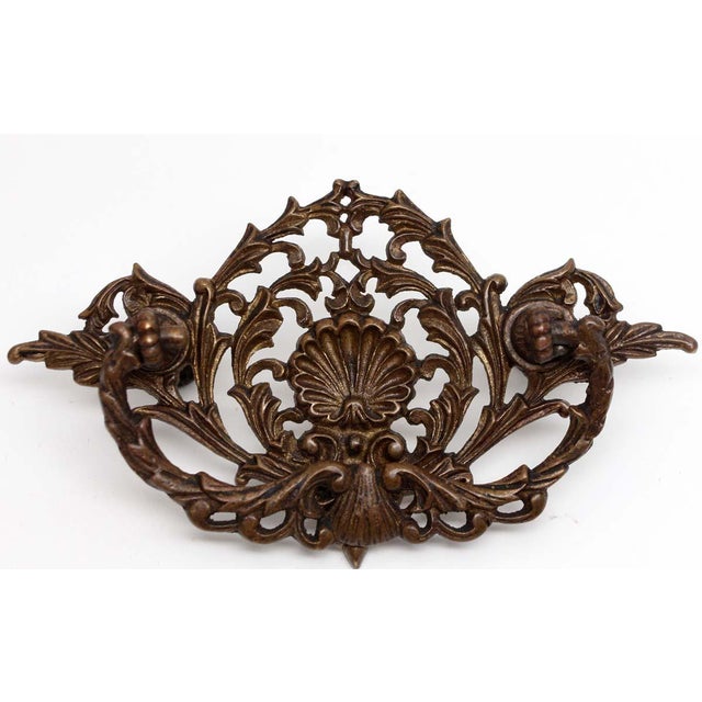 Antique bronze drawer pulls with cut out shell details. Good condition with appropriate wear from age. Priced as a pair....
