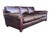 Rich medium brown leather, feather-filled cushions, and an authentic aged patina define this vintage Restoration Hardware...