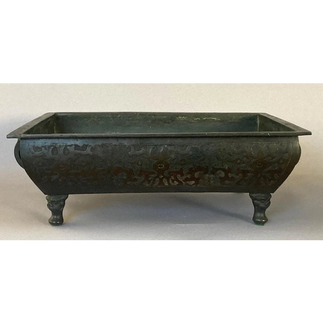 Offering a fine Japanese bronze vessel suitable for a bonsai or an ikebana arrangement. As you can see, the previous owner...