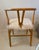 Pair of Wishbone Armchairs with custom goatskin seats. Each chair features a heavy, solid oak wood framework finished in a...