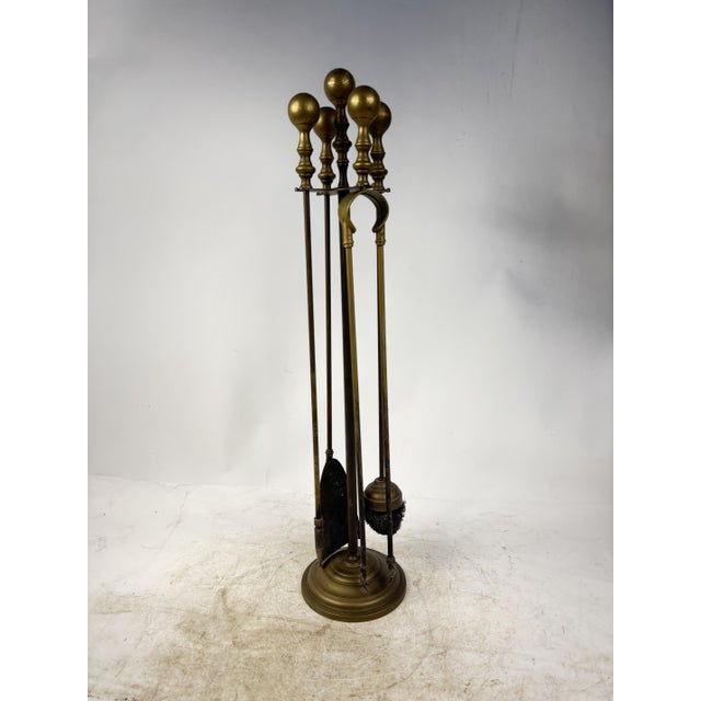Elegant complete fireplace set, including a shovel, poker, tongs, and a matching stand. Ideal as a classic furnishing...