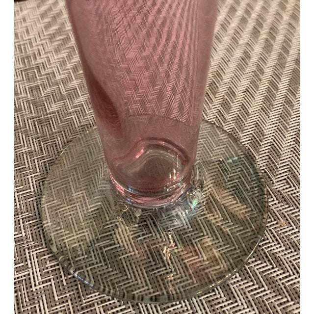 This lovely vase has the look and feel of Murano, but i can't verify that it is. The glass's color could best be described...