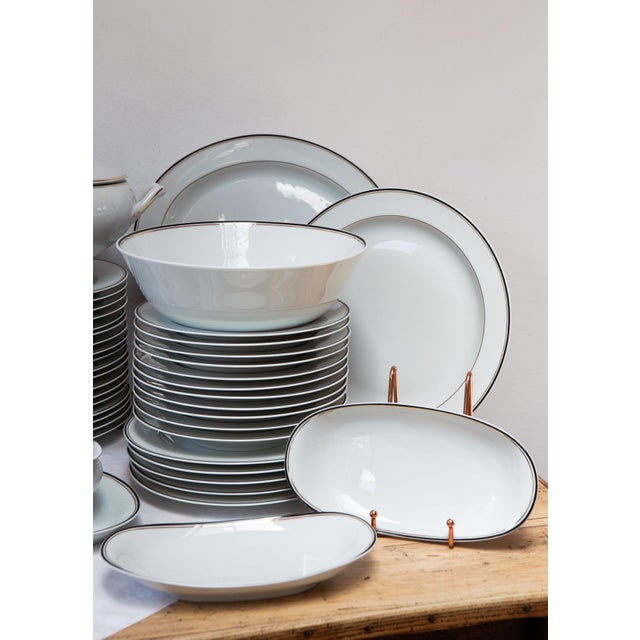 All pieces are signed. The design corresponds to the CRISTAL or PALMYRE pattern with navy blue and fine gold trim. The set...