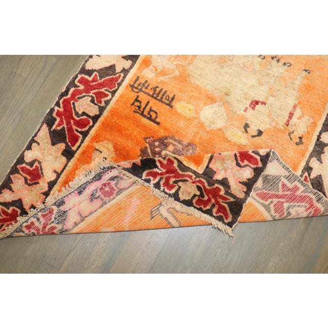 Colorful one-of-a-kind Tibetan rug from the 2nd quarter of the 20th century with an animal motif on a bright orange field