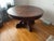 A commanding piece of late 19th century American furniture. This large round extension dining table features an...
