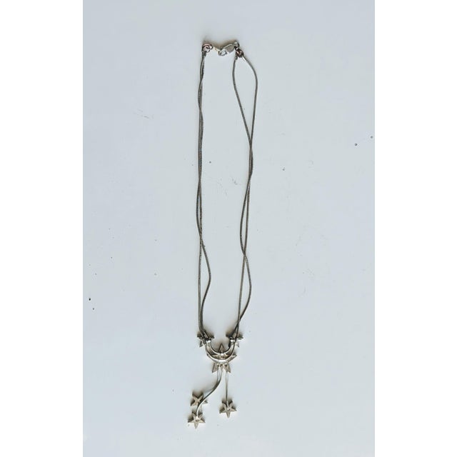 Pretty double stranded silver with enamel stars at the ends. See condition remarks. If it's not silver, it is very...