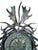 German Antler Clock with carved stag rosettes and fallow antlers,r oe deer antlers and horns. Clock has key. It is in...