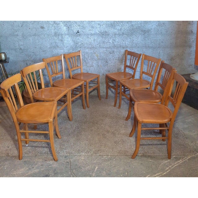 Superb set of 8 authentic French bistro chairs, including 2 made by the prestigious Luterma factory in the 1950s. 2 curved...