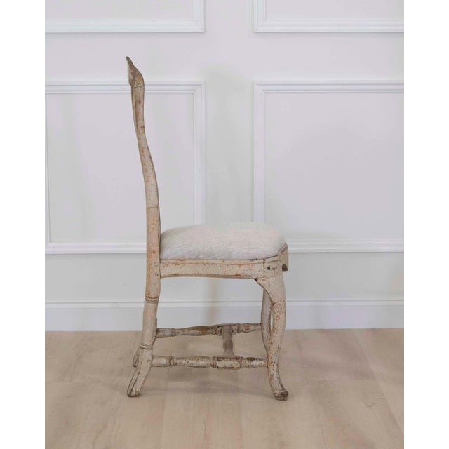 This rococo chair was made in Sweden around 1770 and has been scraped to its original paint and newly upholstered in...