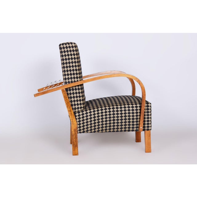 According to the original process, our professional refurbishing team in Czechia has restored and reupholstered the item....