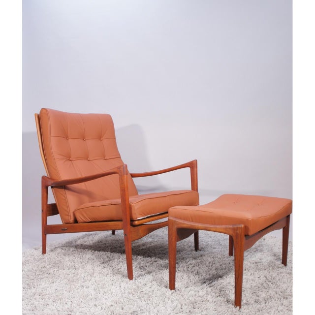 Made in teak new finished surface with oil and wax. New reupholstering in swedish leather and new rubber webbing by Fagas,...