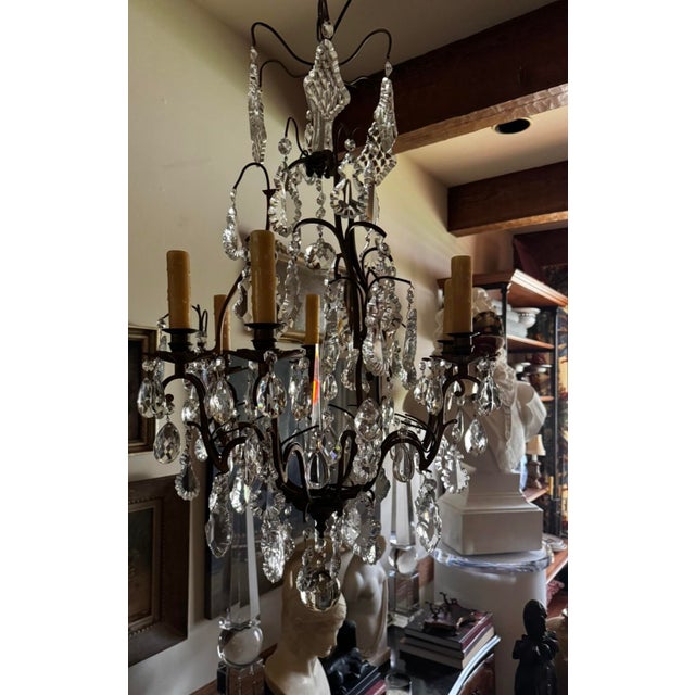 A lovely antique crystal and glass electrified chandelier, gilt brass beautifully decorated with several tiers of large...