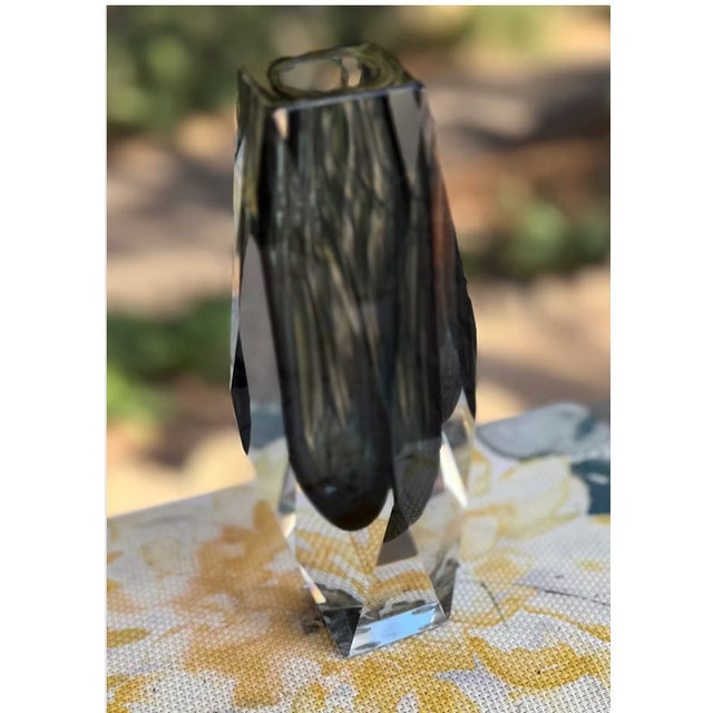 The vase in the image is a Murano glass vase, likely from the 1960s, made in the "sommerso" technique. The vase features a...