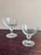 This is a vintage Mid-Century Modern clear glass stemware set. The glasses feature wide, shallow bowls and short stems,...