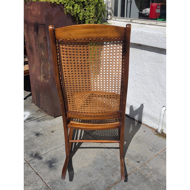 A wonderful Lincoln Rocker , Sturdy and wicker cane in great condition.