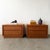 A striking pair of vintage 1980s Postmodern nightstands featuring richly figured burl-style veneer with dramatic movement...
