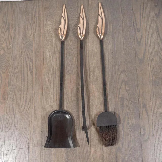This stunning and dramatic Mid-Century Modern four piece fire tool set was realized in the United States, circa 1950. A...