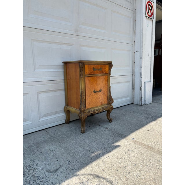 We have a gorgeous French Provincial nightstand for sale that features Louis XV styling, carved details, walnut veneer,...