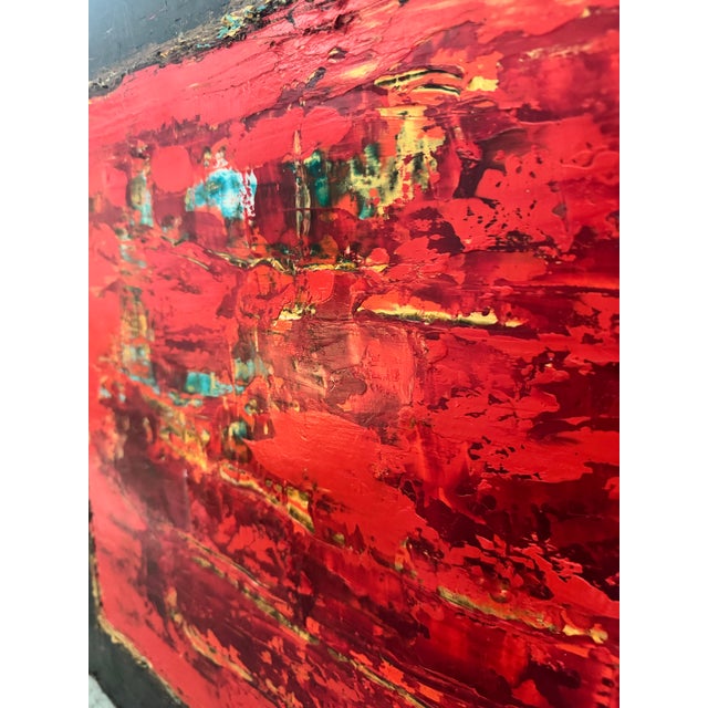 Striking abstract artwork, by Dallas artist Tammera White, featuring a vibrant crimson-red center framed by a dramatic...