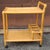 A beautiful handcrafted Late 20th Century Rattan and Cane Rolling Bar Cart. Measures 27" in width, 18.5" in depth and...