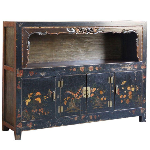 This large display cabinet is in a style unique to Qinghai province in western China and dates to the late 1800s. It has...