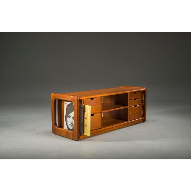 1960s Danish vinyl storage cabinet by Dyrlund, crafted from solid teak. Designed with dedicated space for vinyl records,...