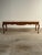 A beautifully proportioned French Provincial coffee table dating to the 1950s, featuring an exceptional marble top resting...