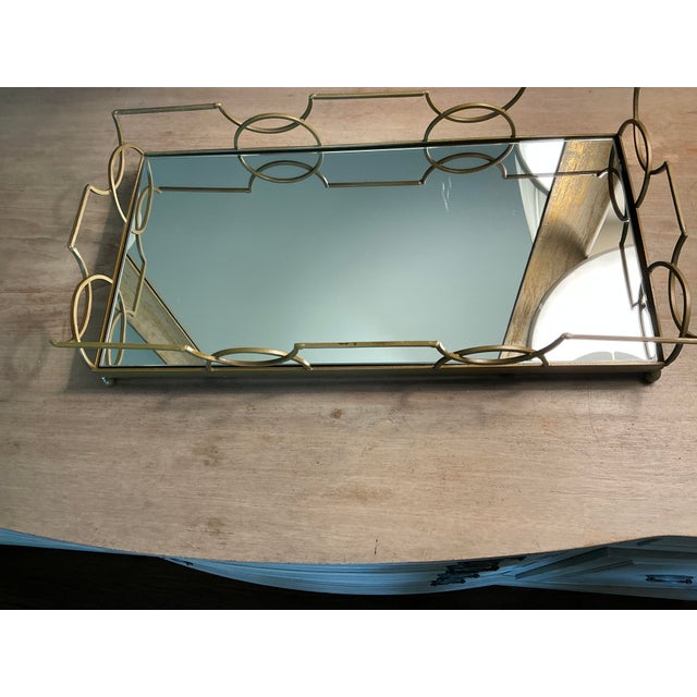 Add elegance to your vanity-with this lovely substantial, modern footed brass vanity tray