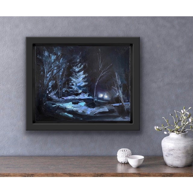 Midnight Drive captures a serene nocturnal landscape illuminated by the soft glow of headlights cutting through the...