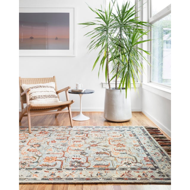 Hooked of 100% wool by skilled artisans in India, this collection of transitional rugs is soft to the touch and displays...