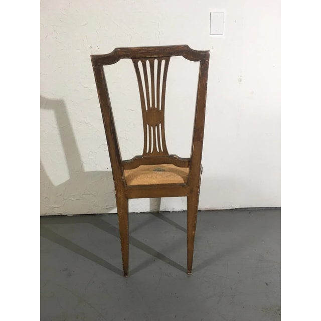Pair of silver leaf Italian accent chairs. The seat covers have wear.