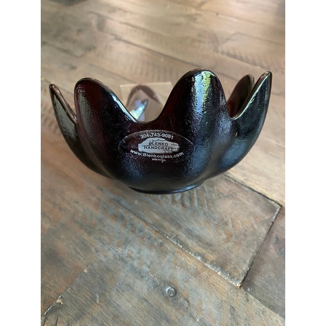 Abstract lotus pattern with a textured exterior and glossy interior. Hand blown. A vintage piece, sought after by...