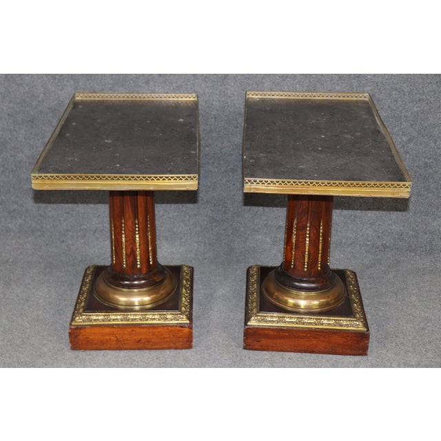 Dimensions: 24.5 inches high x 28.25 inches wide x 15.25 inches deep A sophisticated and architecturally composed pair of...