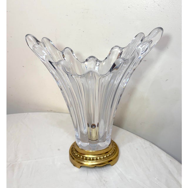This vintage French hand-blown clear glass electric table lamp exudes elegance and charm in a stunning upward splash form....