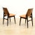 This pair of mid-century occasional/dining chairs were made in England during the 1950s. With ebonized frames and curved...